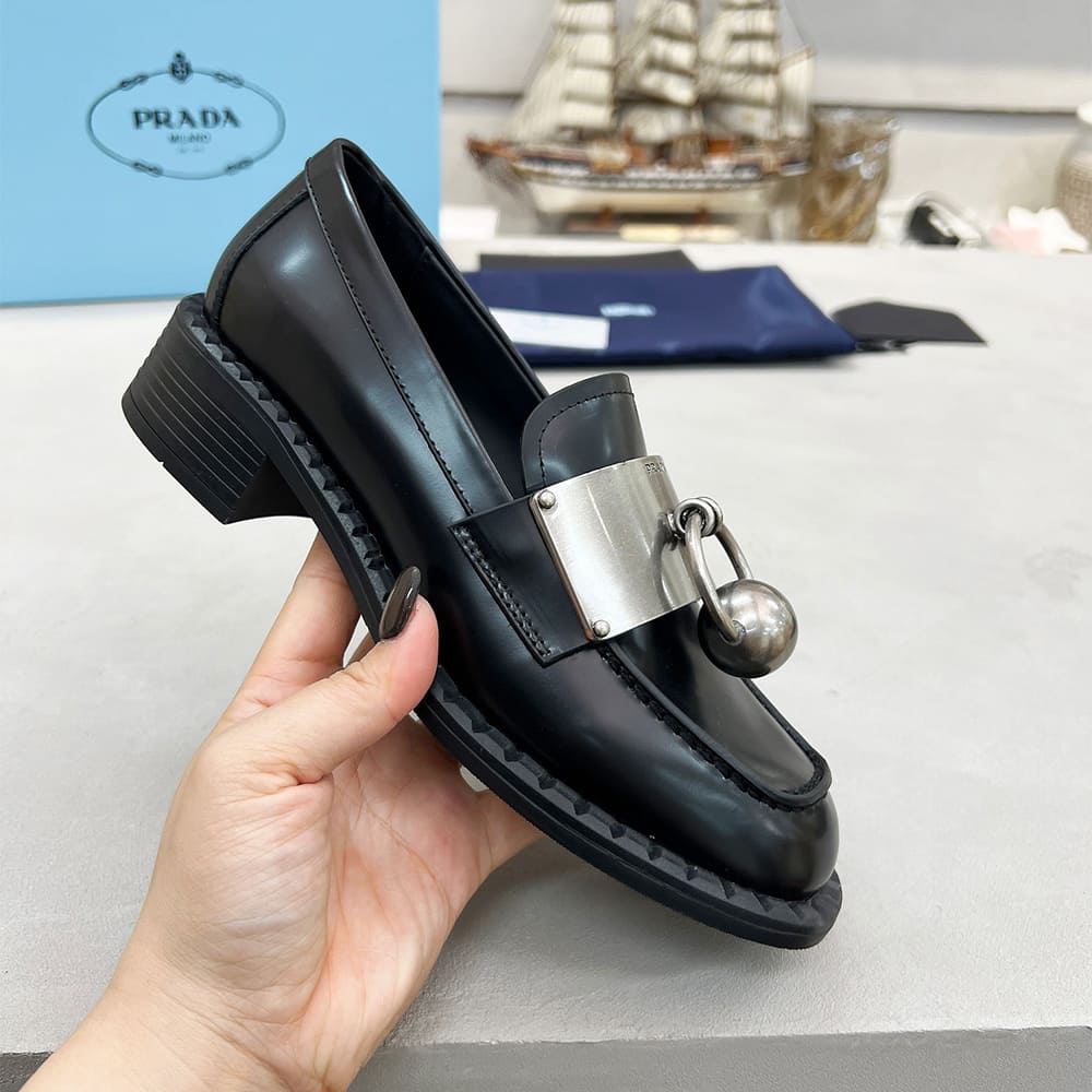 Pra*a Brushed leather loafers with metal details