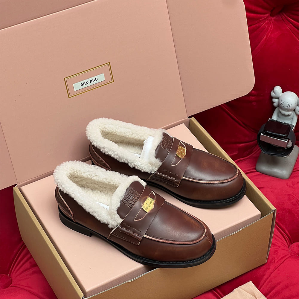 M1um1u Bleached leather and shearling penny loafers