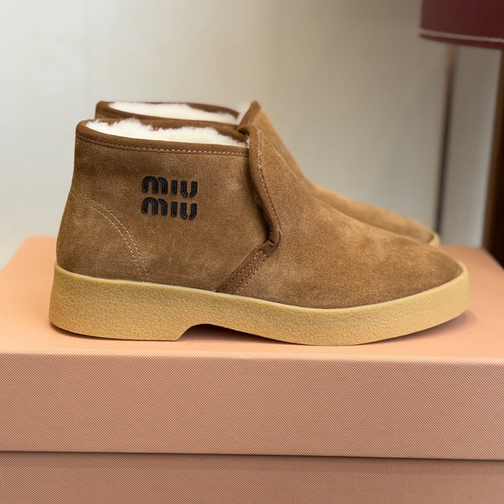 M1um1u Suede and shearling slip-on booties