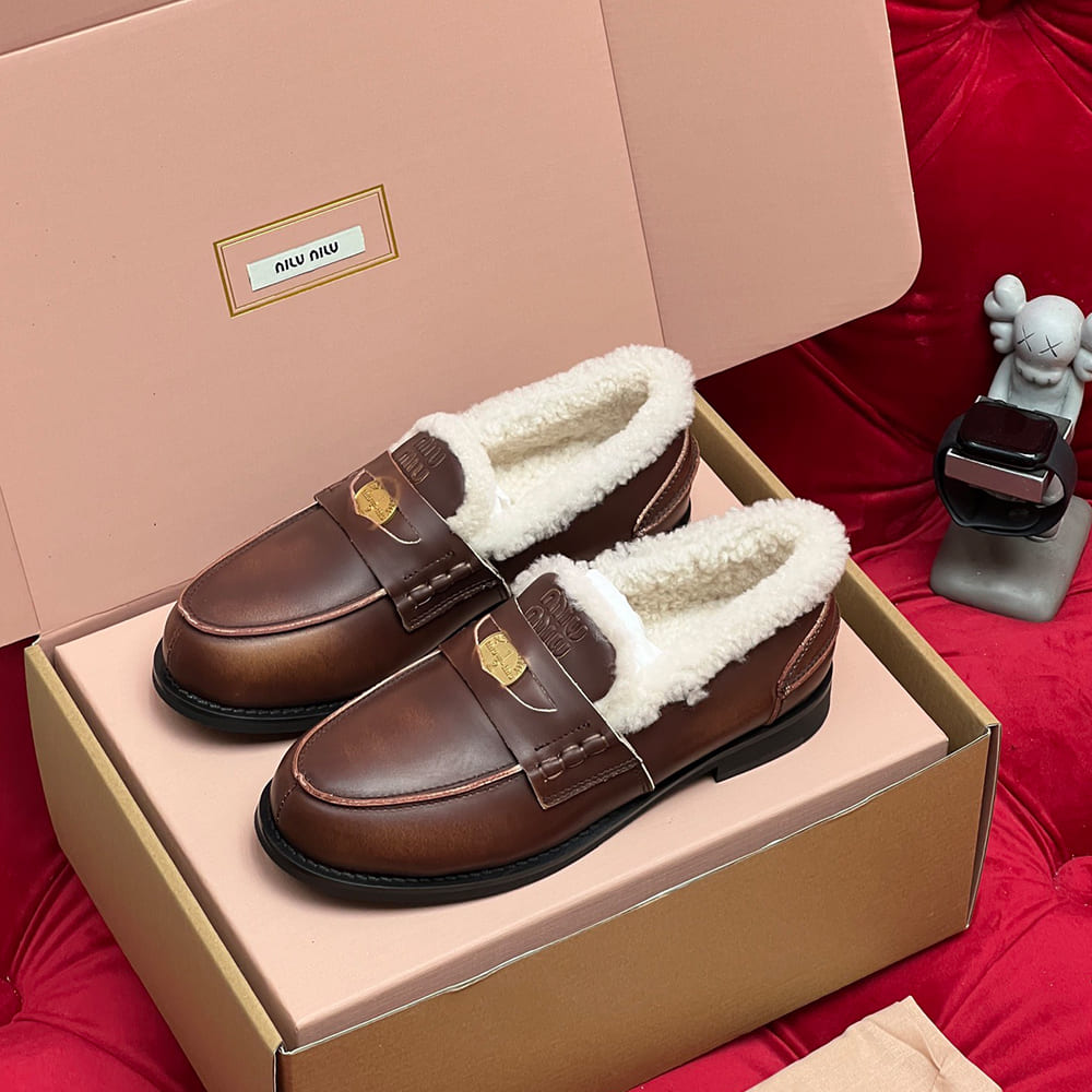 M1um1u Bleached leather and shearling penny loafers