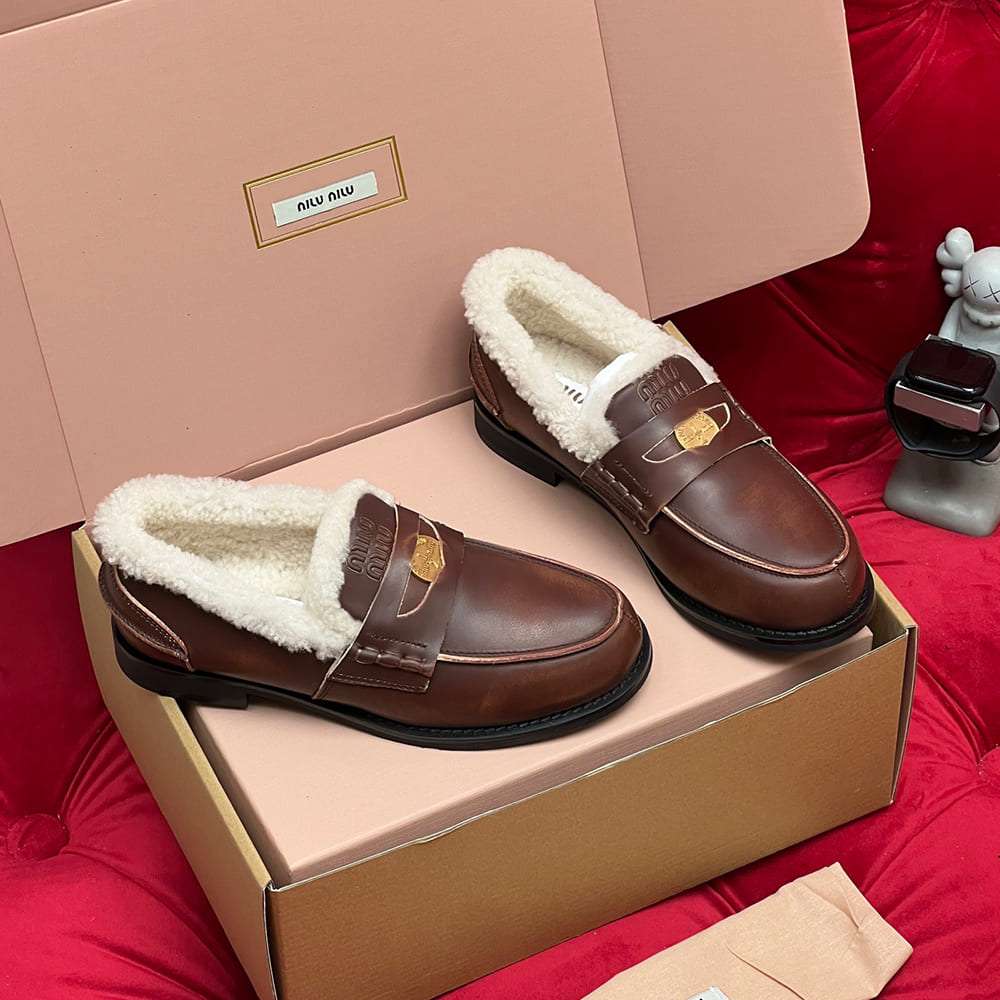 M1um1u Bleached leather and shearling penny loafers