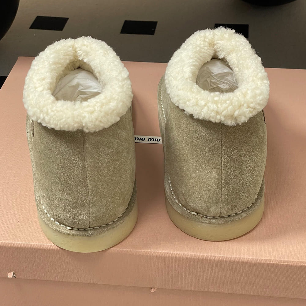M1um1u Suede and shearling slip-on booties