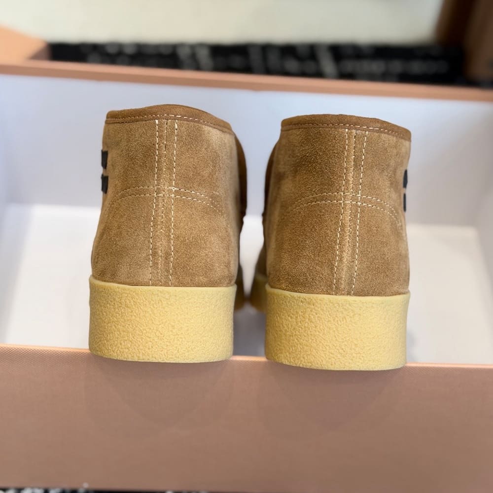 M1um1u Suede and shearling slip-on booties